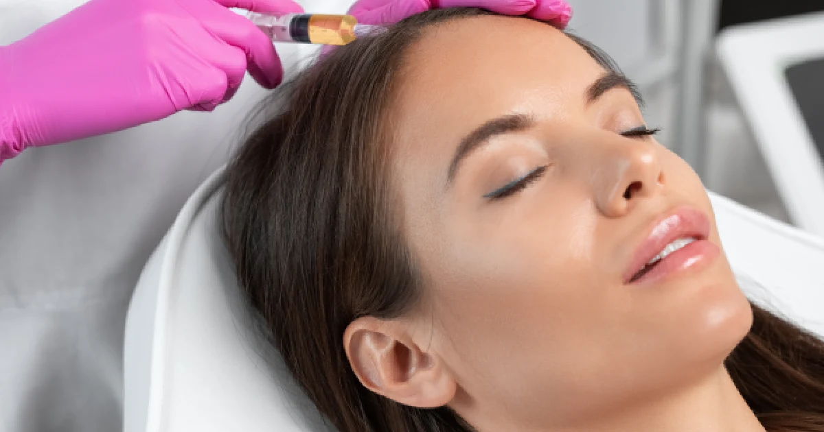 Woman receiving PRP hair restoration treatment in Houston Central