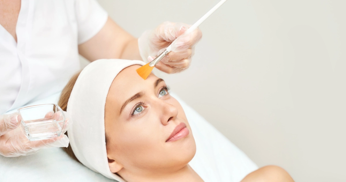 Woman receiving Chemical Peels treatment on forehead at a spa in Houston Central TX
