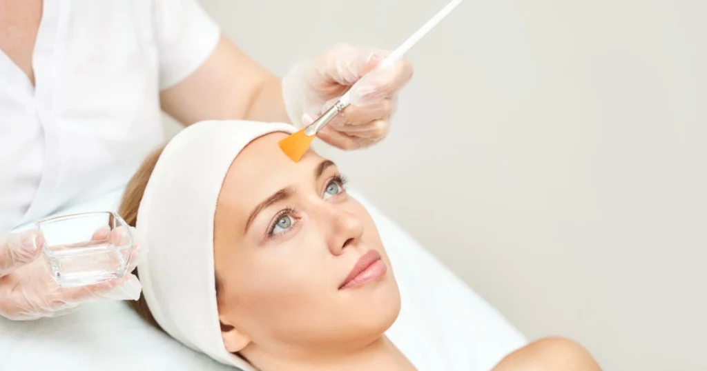 Woman receiving Chemical Peels treatment on forehead at a spa in Houston Central TX
